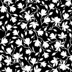 Floral pattern with magnolia flowers. Seamless pattern with magnolia branches silhouettes. Vector black and white seamless floral print