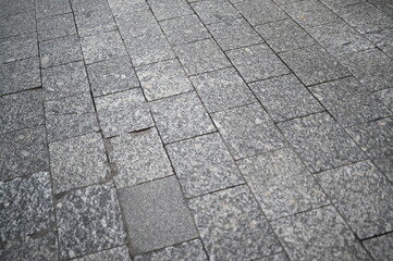 Gray stone pavement background. Urban cobblestone texture with rectangular pattern, modern architecture surface detail.