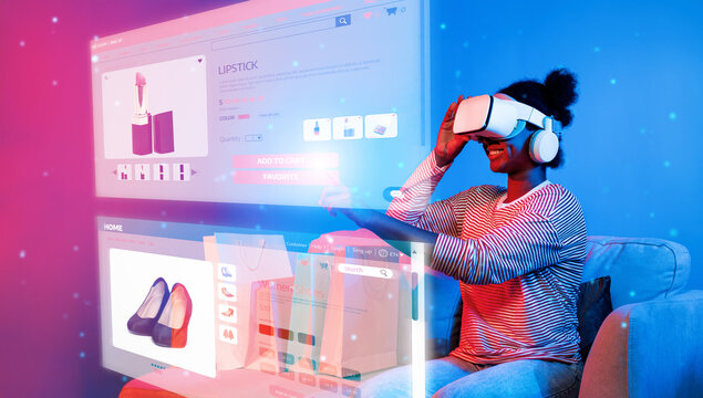 African girl looking list while wearing VR glass and sitting at sofa with shopping bag. Teenager using augmented reality glasses while choosing and buying product at neon color background. Ingenuity. - Powered by Adobe