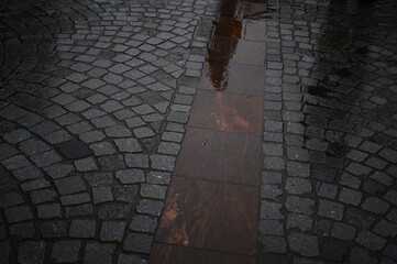 stone paving wet after rain Wet Paving Stones after the Rain with Light of Sun 
