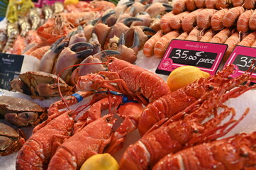 Seafood market display with fresh lobsters, shrimps, octopus, and shellfish. Colorful Mediterranean seafood assortment symbolizing freshness, gastronomy, and coastal lifestyle. Ideal for restaurants, 