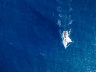 Summertime vacation. Drone view on the yacht. Sail yacht on the sea as a background. .Sea and waves...
