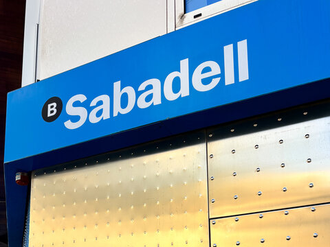Sabadell bank signage on a modern building exterior showcasing vibrant blue colors and contemporary design elements, financial services concept