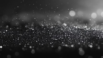 Sparkling abstract background featuring glittering particles in black and white ideal for elegant designs and festive visual themes with a captivating and timeless aesthetic
