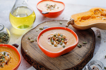 Traditional autumn butternut squash soup with seeds.