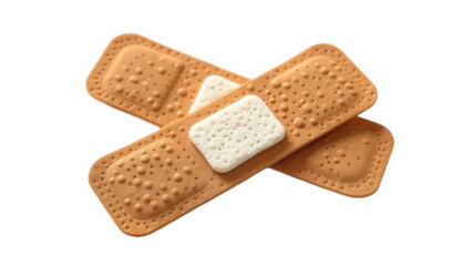 Two adhesive bandages crossed on a black background providing wound care and protection from infection