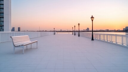 Obraz premium A lone white bench sits on a pristine white pier at sunset. Lamp posts line the pier, leading to a calm body of water. The image is high-resolution, with soft, warm lighting. Its a serene and minim