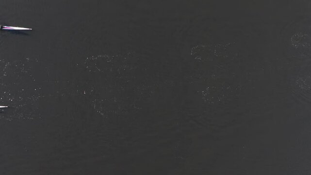 Two sculls racing each other in slow motion