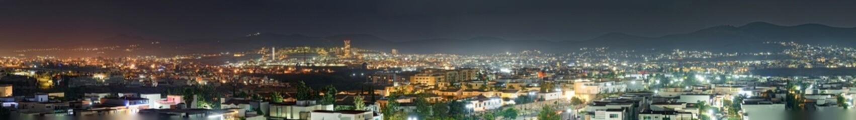 Popocat&eacute;petl volcano panorama through the window during nighttime