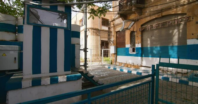 The fence that divides the demilitarized zone in Nicosia, Cyprus. Prohibition sign, urban landscape of the island. High quality 4k footage