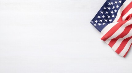 Obraz premium A folded American flag rests in the bottom right corner of a white wooden surface. The image is clean and simple, with high resolution and even lighting. Its style is minimalist and patriotic. The