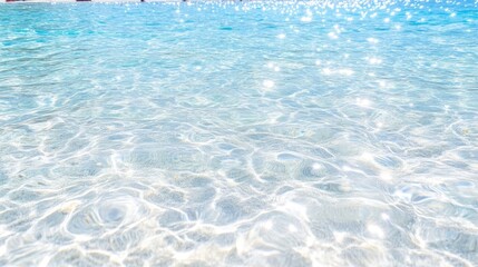 Crystal-clear shallow water, sunlit surface.  Ripples and sparkles