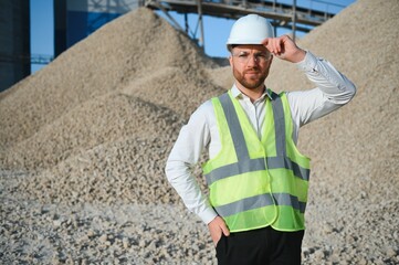 An engineer at a crushed stone or gravel plant. Stone mining