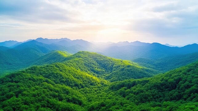 A vibrant green mountain range stretches to the horizon, bathed in sunlight. The image features rolling hills covered in lush vegetation. High resolution with excellent clarity and natural lighting.