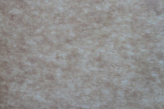 Recycled brown paper texture. Brown caotic fibers on the beige background