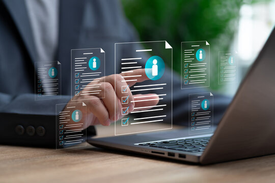 HRM Concept, Human Resource Management, Businessman selects the best candidate human from online job applications, Select personnel based qualifications, finds expert specialists to join for work