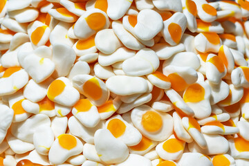 A stack of chewy candies shaped like fried eggs close-up