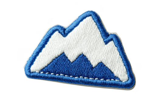 A blue and white embroidered patch features stylized mountain design, evoking sense of adventure and exploration. patch is outlined in blue, adding contrast and definition