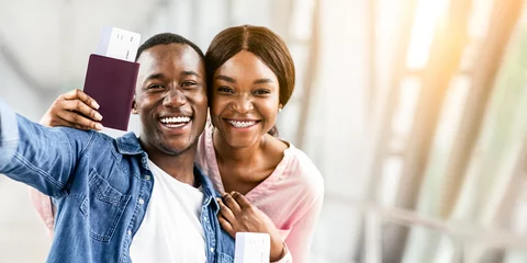 Gordijnen Memorable Trip. Happy Black Couple Capturing Selfie Photo At Airport Terminal, Smiling At Camera, Closeup © Prostock-studio