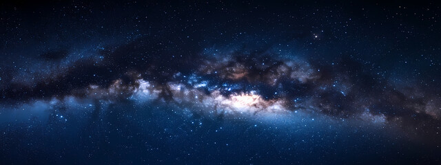 Fototapeta premium Galactic River: A breathtaking, high-definition panorama of the Milky Way galaxy unfurls, displaying a vibrant cosmic river of stars and nebulae in a dark, captivating expanse.