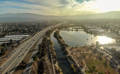 Aerial view of a lake and highway in Campbell, California, USA. The photo shows the urban landscape...