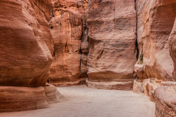 The Siq gorge, main entrance to the ancient city Petra, Jordan