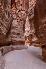 The Siq gorge, main entrance to the ancient city Petra, Jordan