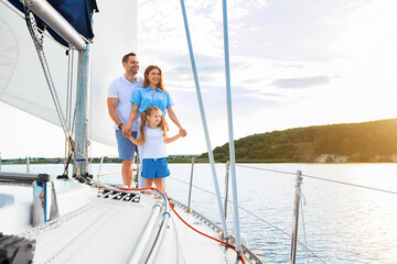 Vacation On Yacht. Family Of Three Sailing Relaxing During Boat Ride Standing On Deck Looking...