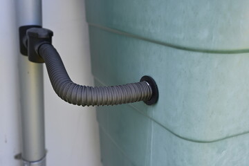 Close-up of Water Tank with Flexible Hose