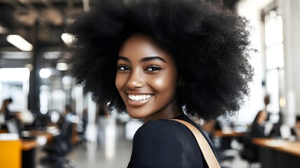 Smiling Black Woman with Afro in Modern Office