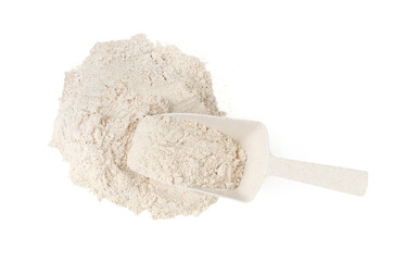 Pile of brown rice flour and scoop isolated on white, top view