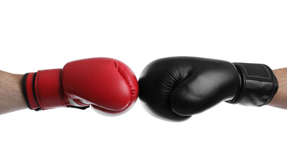 Men in boxing gloves fighting on white background, closeup
