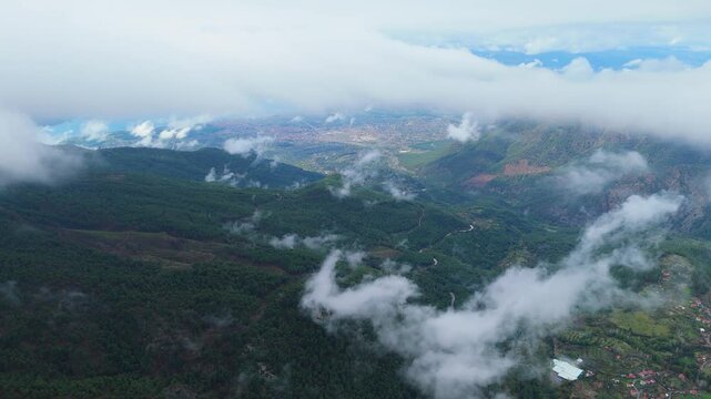road in the forest and cloudy sky from the mountains, view of mugla koycegiz lake from a distance