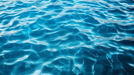 Obraz premium Reflective water surface with subtle waves in azure blue. Water background