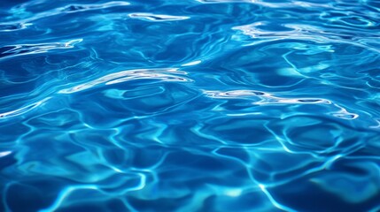 Reflective water surface with subtle waves in azure blue. Water background