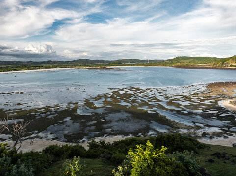 Scenic coastal view with low tide patterns, Lombok, Indonesia