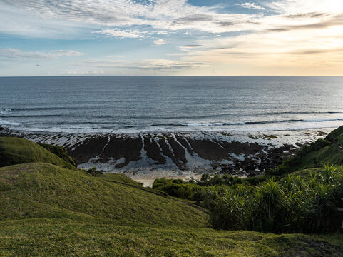 Low tide exposing coral lines at sunset, Lombok, Indonesia
