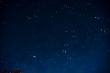 Star trail in the night sky, 7 exposures at 45 seconds,30 second intervals. Stacked.