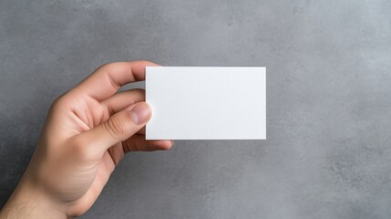 Blank business card held in hand