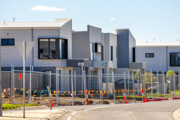 A development of new modern townhouses or multi-unit residences in an outer suburb in Australia,...