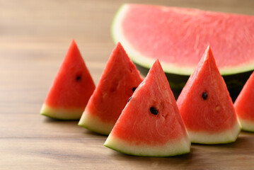 Sliced of watermelon on wooden background, Tropical fruit in summer season