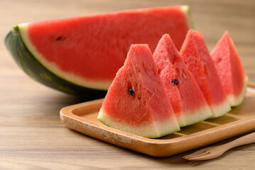 Sliced of watermelon on wooden plate ready to eating, Tropical fruit in summer season