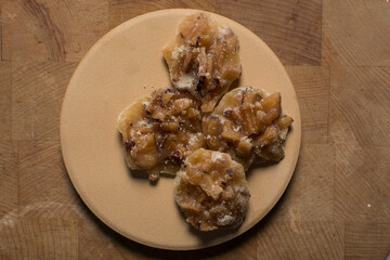 Overhead view of nigerian coconut candy, top view of candied coconuts discs, flatlay of bukayo candy