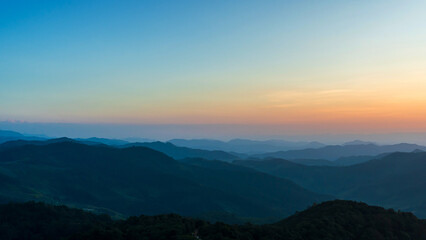 Natural landscape sunset sky on top of mountain and valleys.