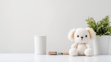 Crocheted Puppy with Cup and Plant Minimalist Style, Bright Studio Lighting, Frontal Centered Shot, Soft Textures, Peaceful Scene, Nursery Decor, Soft Neutral Tones, Ideal for Baby Product Ads