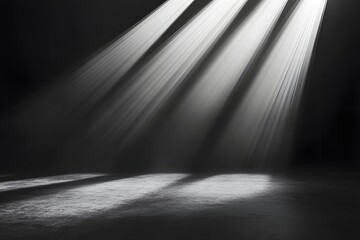 Dramatic spotlight beams on dark floor