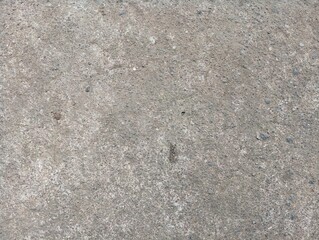 Rough Concrete Surface Background With Small Stones and Natural Textures. Ideal for Industrial Design, Construction Themes, and Minimalist Aesthetics