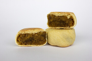 Bakpia pathok , Indonesian Traditional Cake with Chinese Influence. It made from a mixture of green beans, cheese and sugar, which is wrapped in flour, then baked.