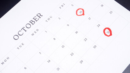 Red circle marked on a calendar at 10 and 31 of October