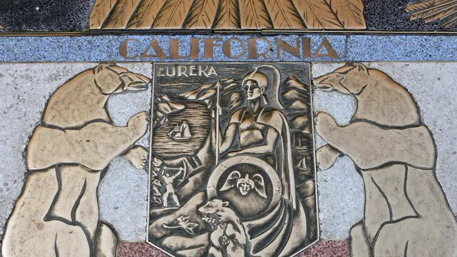 Bas relief plaque for California is inlaid into Hoover Dams plaza's surface, one of the seven states that fall within the Colorado River's basin. Hoover Dam, Arizona, Nevada, USA